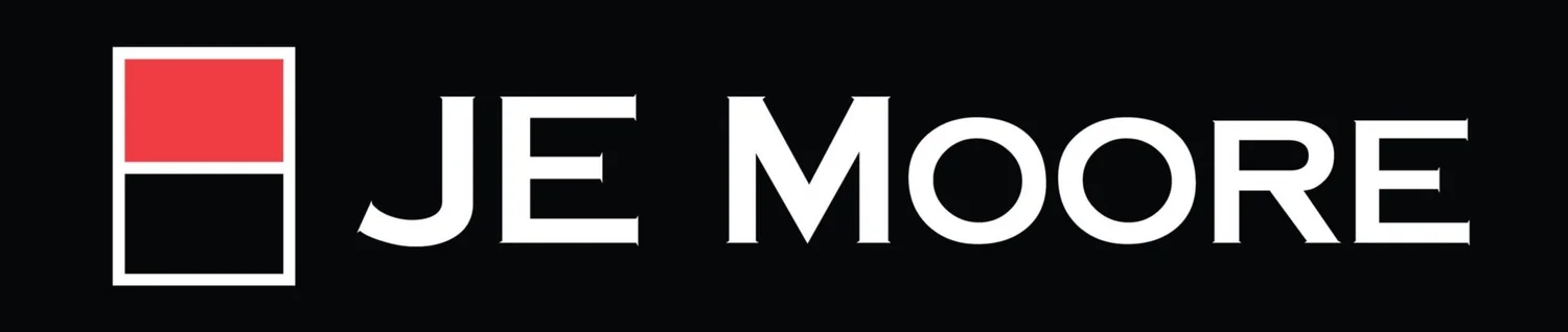 JE Moore logo